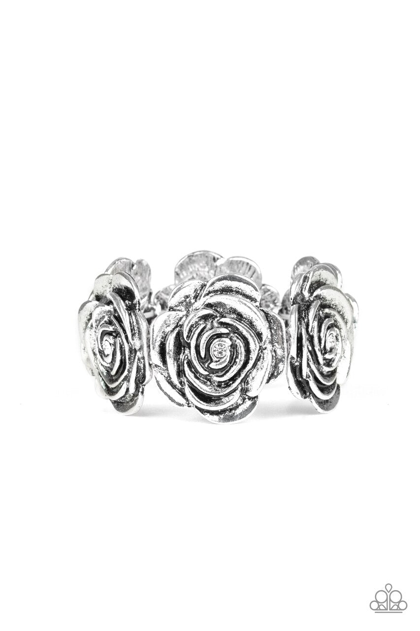 Pulsera blanca con extravagancia floral