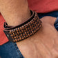 Expansión urbana - Pulsera marrón Glow 2022